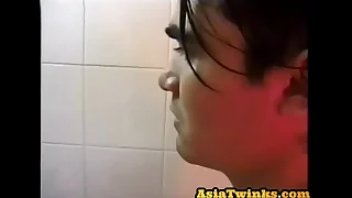 Asian twunk enjoys stroking his strigous shaft in bm