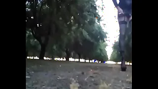 Crossdresser walking in the almond orchard